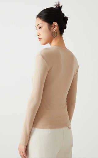 Apricot Tencel wool v-neck long-sleeve top viewed from back, fitted silhouette