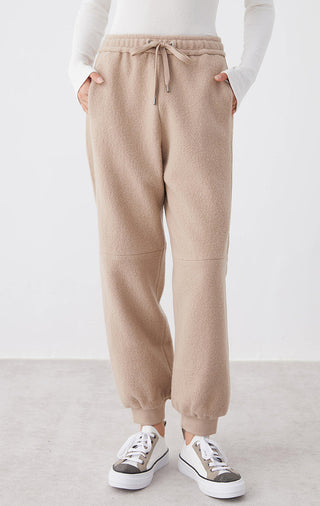 Camel wool drawstring knit jogger pants with ribbed waistband and tapered legs