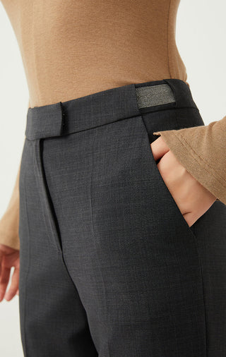 Dark gray pants close-up: waistband with belt loops and front fly detail