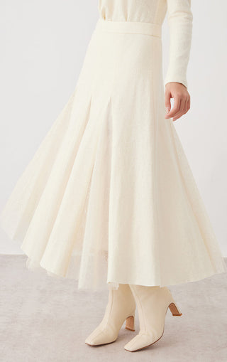 Beige A-line panelled midi skirt with sheer lace detail under the hem