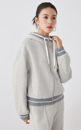 Light gray wool hooded zip jacket with front zipper and stripe-accent cuffs