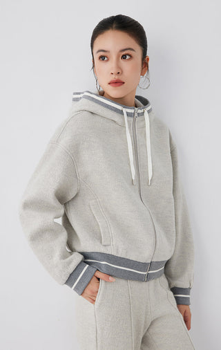 Light gray wool hooded zip jacket with kangaroo pocket and striped hem