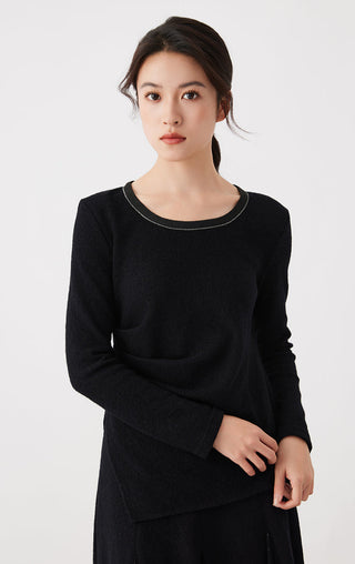 Black long-sleeve wool-cotton top with crew neck and front drape; front view