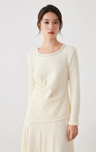 Beige wool-cotton top with long sleeves, crew neck, and layered front drape detail
