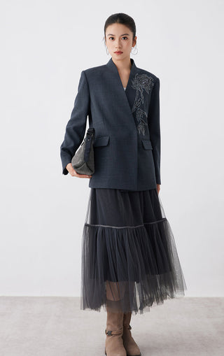 Dark gray tulle midi skirt with elastic waistband and tiered ruffle silhouette