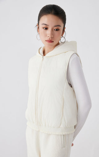 White hooded layered vest with zip-front and ribbed waist hem