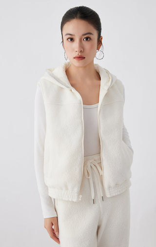 White hooded vest with zipper and drawstring waist, side pockets