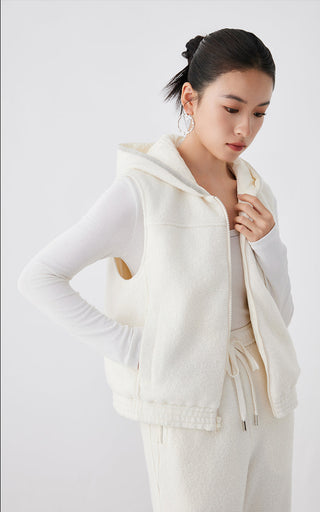 White hooded layered vest with zip-front and ribbed hem