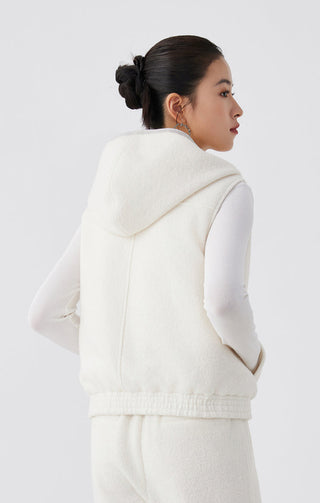 Back view of white hooded layered vest with ribbed waist and hem
