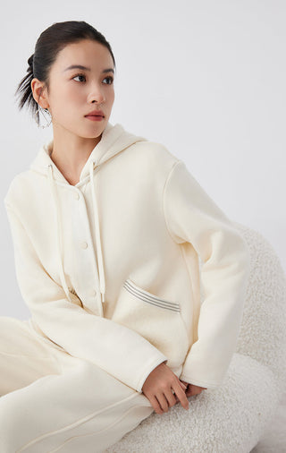 Cream hooded jacket with drawstring ties and textured chest pocket panels