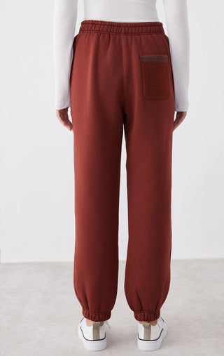 Ankela Red relaxed-fit pants with front patch pocket and elastic waistband