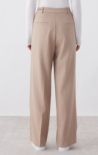 Camel tailored straight-leg pants, back view with welt pockets