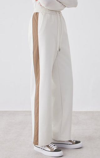 White wide-leg pants with tan side stripe panel and adjustable drawstring