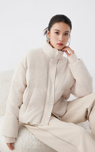 Beige shimmer down jacket, front close-up with high neck and snap buttons