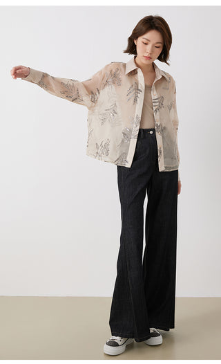 Camel embroidered silk button shirt worn with dark pants and silver-thread leaf motif