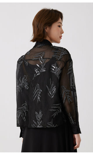 Back view of black silk embroidered shirt with silver-thread leaf motifs