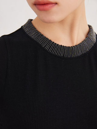 Close-up: black tank top with ribbed knit and sparkling beaded neckline trim