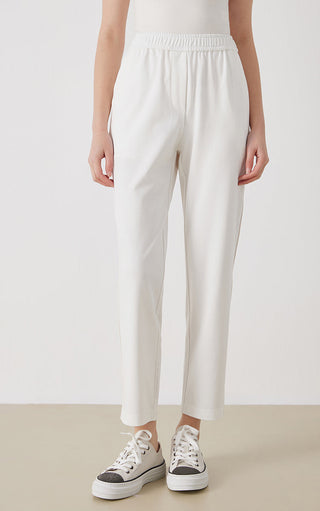 White pima cotton blend tailored pants with elastic waist and tapered legs