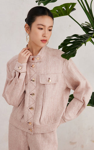 Rose linen jacket with front yoke seam, flap pockets, and gold button closures