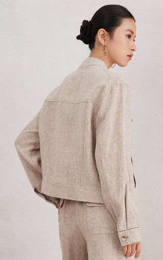 Beige tailored linen jacket, back and shoulder seams with button detail at cuff