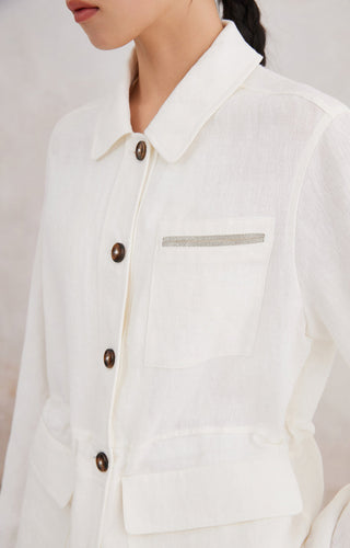 Ivory white linen utility shirt close-up: chest pocket with beaded stripe detail