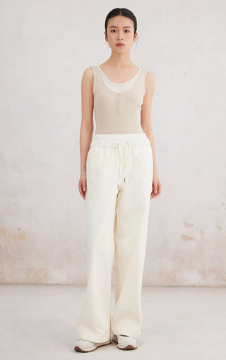 Beige tank top with scoop neck and button placket, sleeveless