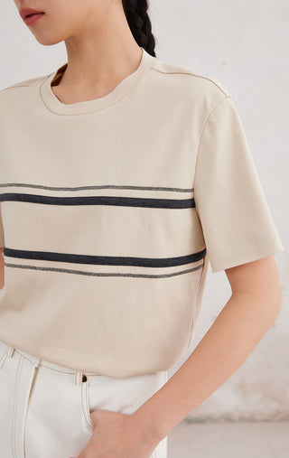Close-up of apricot/cream cotton stretch T-shirt chest stripe with beaded trim