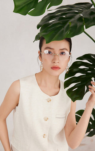 Natural linen sleeveless vest with round neckline and button placket