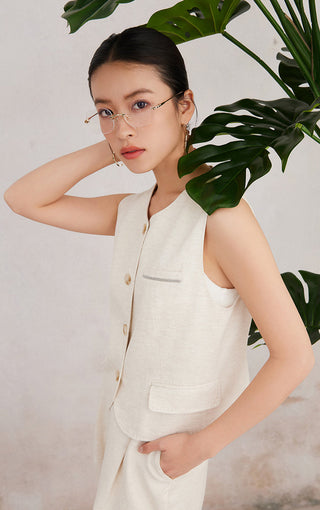 Light linen sleeveless vest with chest pocket and curved hem