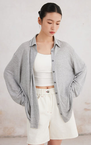 Light gray button-up shirt over white top, beaded collar trim, button front and sleeves