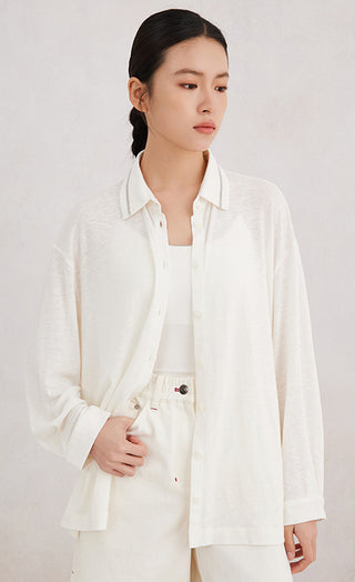 White linen-look button-up shirt, beaded collar trim, chest button placket, side profile