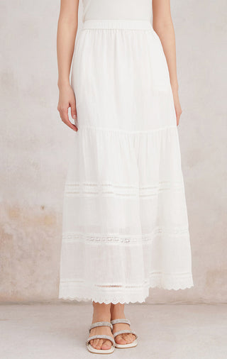 White ramie tiered maxi skirt with embroidered trim and ruffled layers