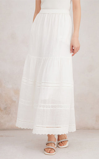 White tiered ramie maxi skirt with elastic waist, stitched stripe bands, and scalloped hem