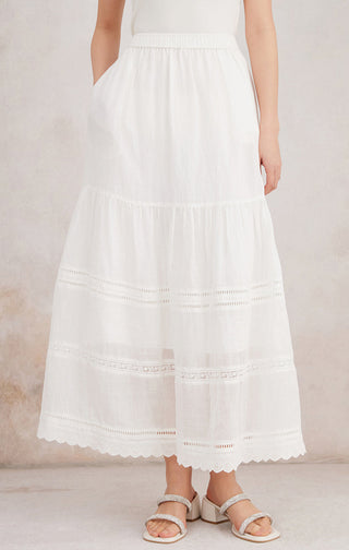 White ramie tiered maxi skirt with elastic waistband, embroidered stripe tiers, lace scallop hem