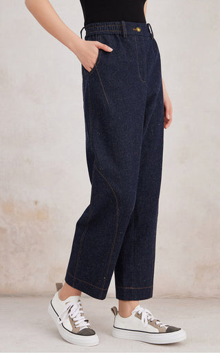 Dark denim blue straight-leg trousers with elastic waistband and side seam stitching