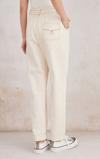 Ivory white straight-leg trousers, back view with square patch pocket and elastic waist