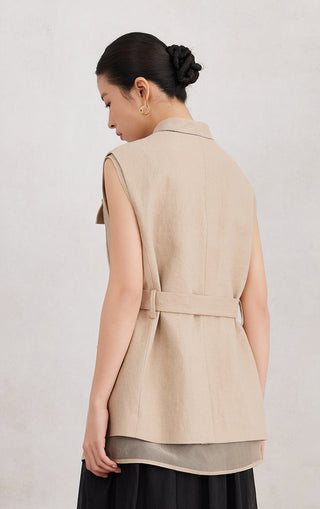 Back view of camel linen sleeveless vest with self-tie belt at waist