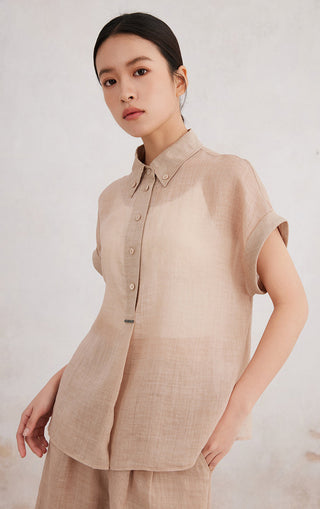 Apricot short-sleeve button-up shirt with relaxed fit and button-front placket.