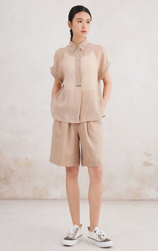 Apricot ramie Tencel short-sleeve button-up shirt with pointed collar and button front.