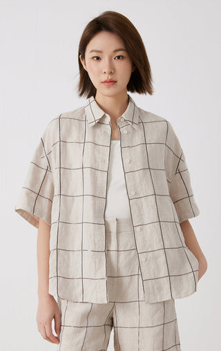 White linen short-sleeve button-up shirt with point collar and dark grid stitch pattern
