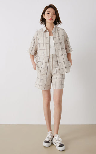 White linen short-sleeve button-up shirt with grid stitch pattern and point collar