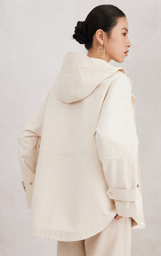 Back view of beige cotton hooded jacket with adjustable drawstring hood