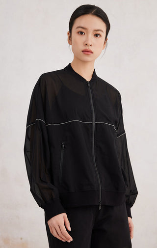 Black zip-up hoodie with contrast piping, side profile, front zip and pocket openings