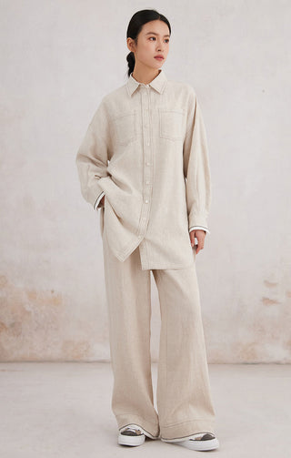 Beige linen button-front shirt with contrast cuffs, chest pockets, relaxed fit