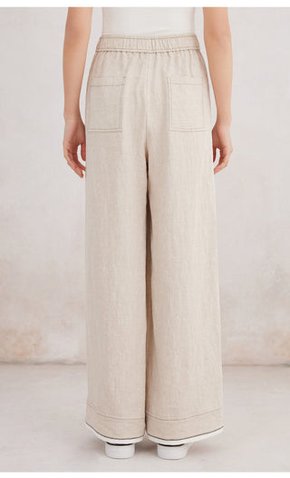 Beige linen wide-leg trousers with front patch pockets and elastic waist