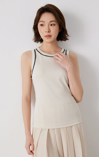 Beige cotton stretch tank top, model wearing it with black-trim crew neck