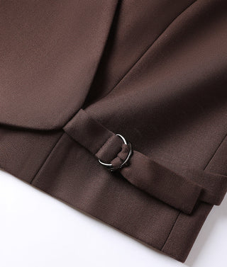 Dark brown wrap vest close-up of tie belt with metal ring detail at waist