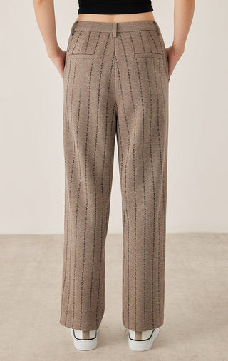 Dark camel straight pants with pleats and vertical stripe embroidery, back view