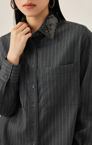 Gray pinstripe shirt close-up: beaded collar and button front
