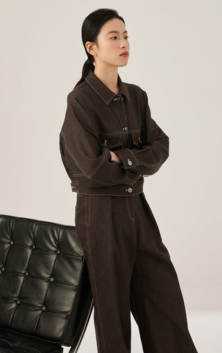 Brown cotton-blend wide-leg trousers worn with a cropped jacket; side view